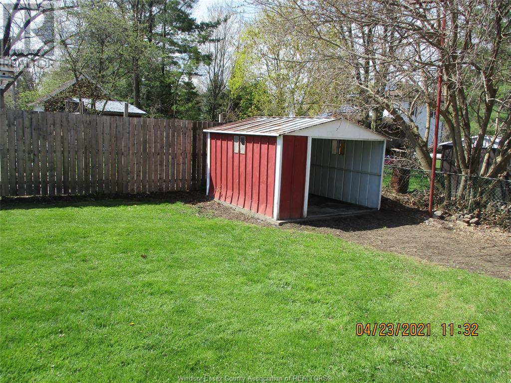 This image has an empty alt attribute; its file name is exterior-backyard-shed.jpg